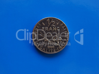 Half franc coin, France over blue