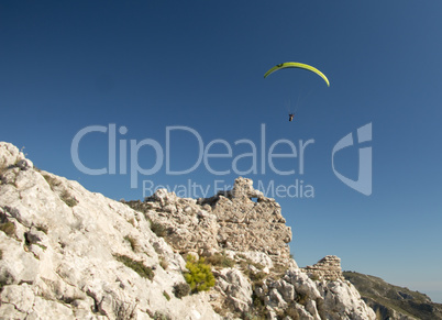 Paraglider visiting ruins of an old castle