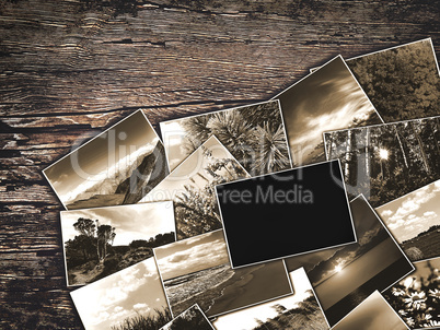 old vintage photos on a wooden background