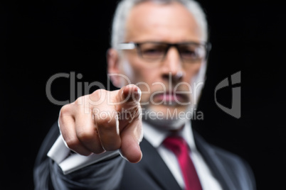 Businessman pointing with finger