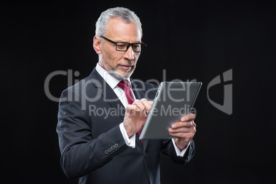 Businessman holding digital tablet