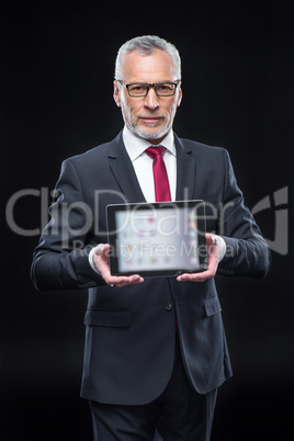 Businessman holding digital tablet