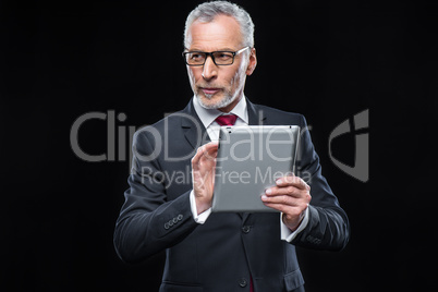 Businessman holding digital tablet