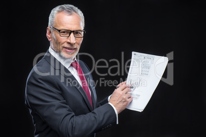 Businessman holding papers