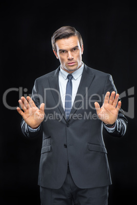 Handsome businessman gesturing