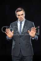 Handsome businessman gesturing