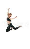 Slim sportswoman gracefully jumping in studio