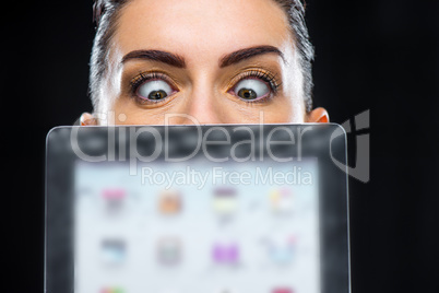 Businesswoman showing digital tablet
