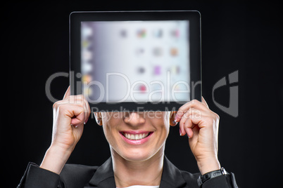 Businesswoman showing digital tablet
