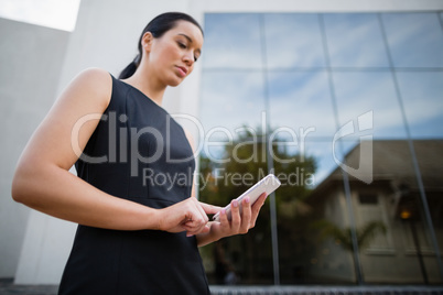 Businesswoman using mobile phone