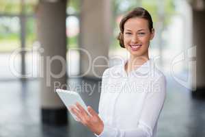 Businesswoman holding digital tablet