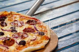 Delicious italian pizza served on pizza peel