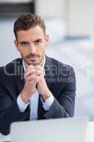 Businessman sitting with laptop