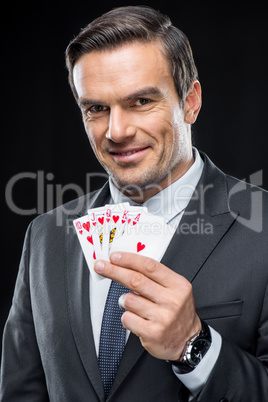 Man holding playing cards
