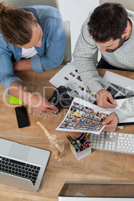 Photographers working together at desk