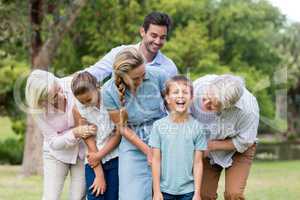 Multi-generation family enjoying together in park