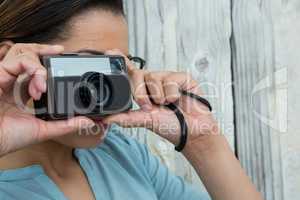 Female photographer with old fashioned camera