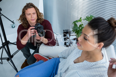 Female model posing for photographer