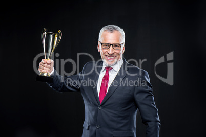 Businessman with award cup