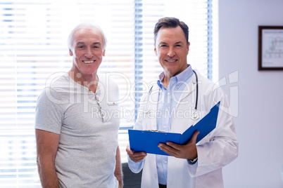 Portrait of smiling doctor and senior man