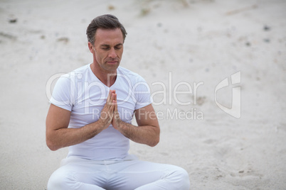 Mature man doing meditation