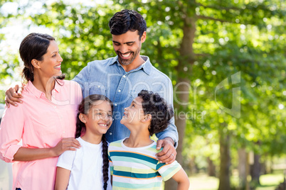 Happy family enjoying together in park