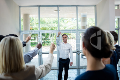 Business executives celebrating at conference center