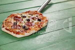 Delicious italian pizza served on pizza peel