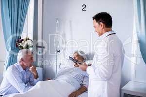 Senior patient interacting with doctor