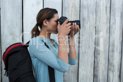 Female photographer with digital camera