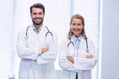 Portrait of doctors standing with arms crossed