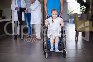 Portrait of smiling disable girl in wheelchair
