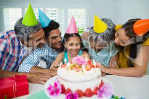 Happy multigeneration family celebrating birthday party