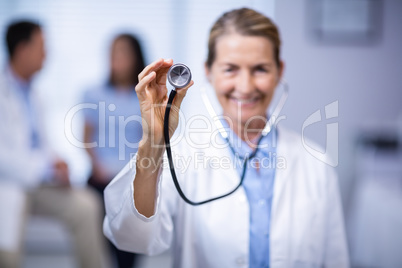 Female doctor holding stethoscope