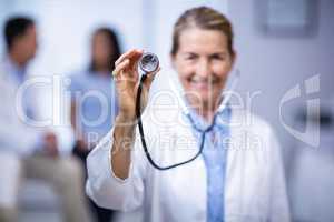 Female doctor holding stethoscope