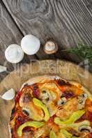 Various species with pizza arranged on wooden tray