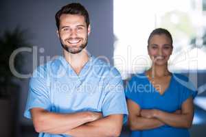 Portrait of doctors standing with arms crossed