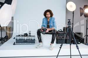 Male photographer standing in studio