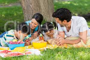 Happy family enjoying together in park