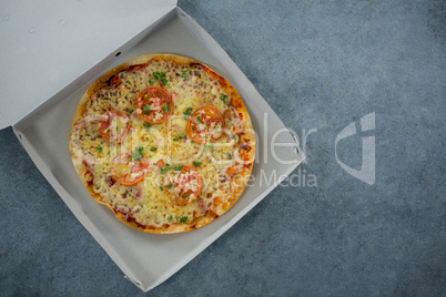 Italian pizza served in a opened box