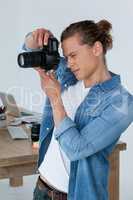 Photographer clicking picture using digital camera