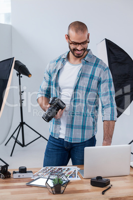 Male photographer working at desk