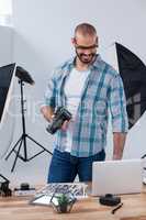 Male photographer working at desk