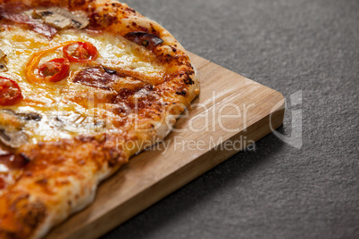 Delicious italian pizza served on wooden board