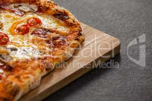 Delicious italian pizza served on wooden board