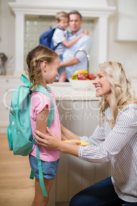 Mother interacting with her daughter while going to school