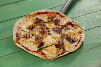 Delicious italian pizza served on pizza peel