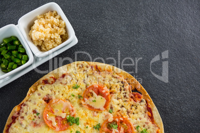 Italian pizza served with ingredients