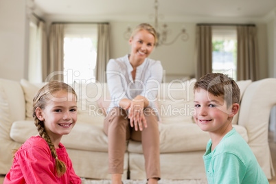 Mother and kids smiling in living room