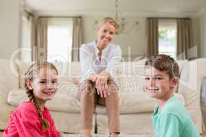Mother and kids smiling in living room
